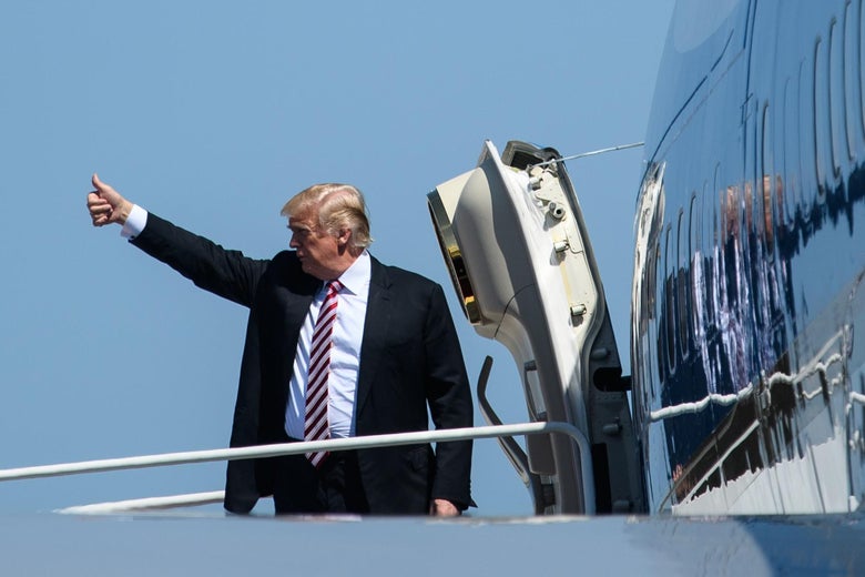 Donald Trump gives a thumbs up before boarding Air Force One.